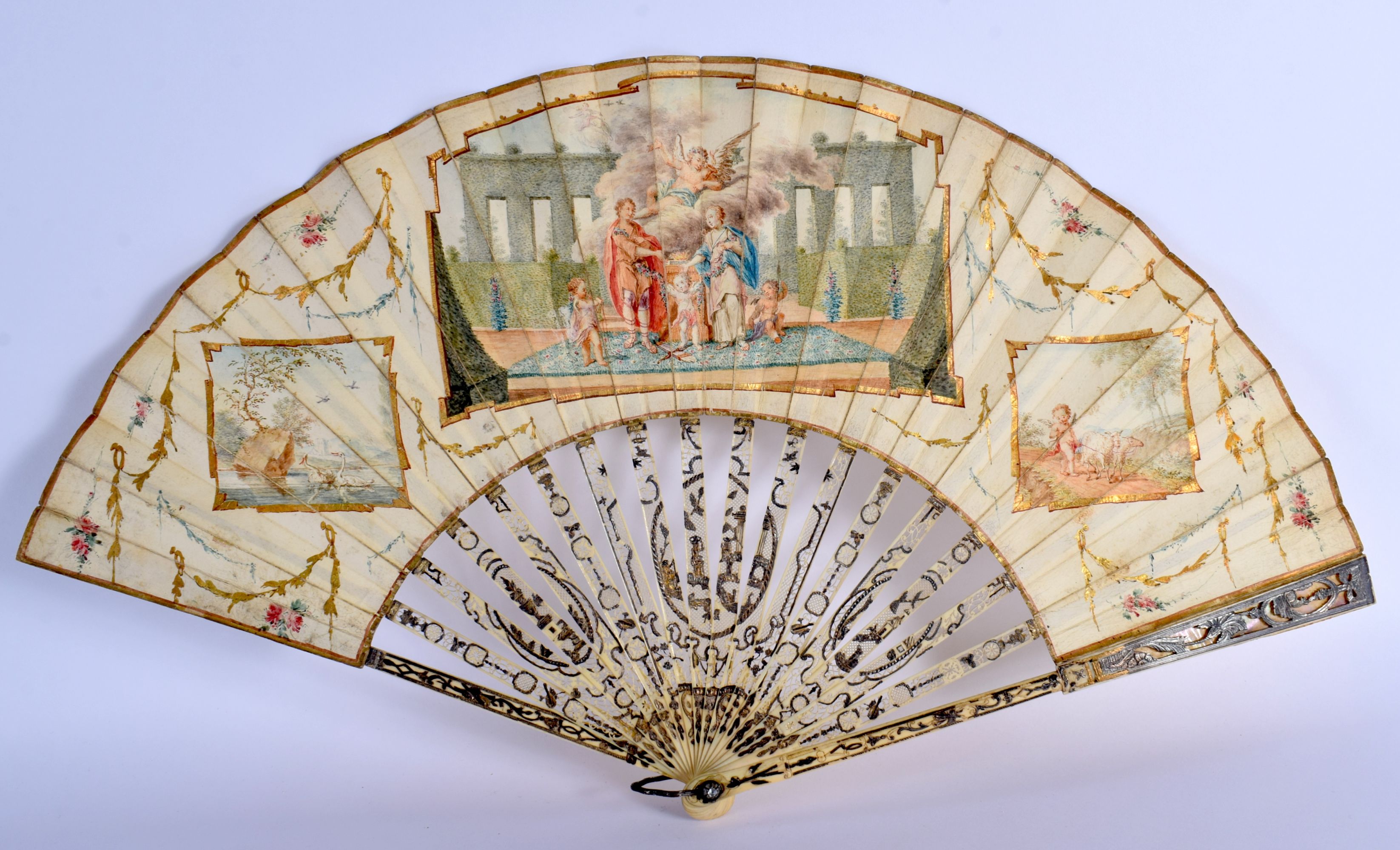 A FINE LATE 18TH CENTURY EUROPEAN GRAND TOUR TYPE FAN with paper leaf supports and silvered sticks.