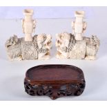 A PAIR OF LATE 19TH CENTURY CHINESE CARVED IVORY BUDDHISTIC FIGURES modelled with urns upon there ba