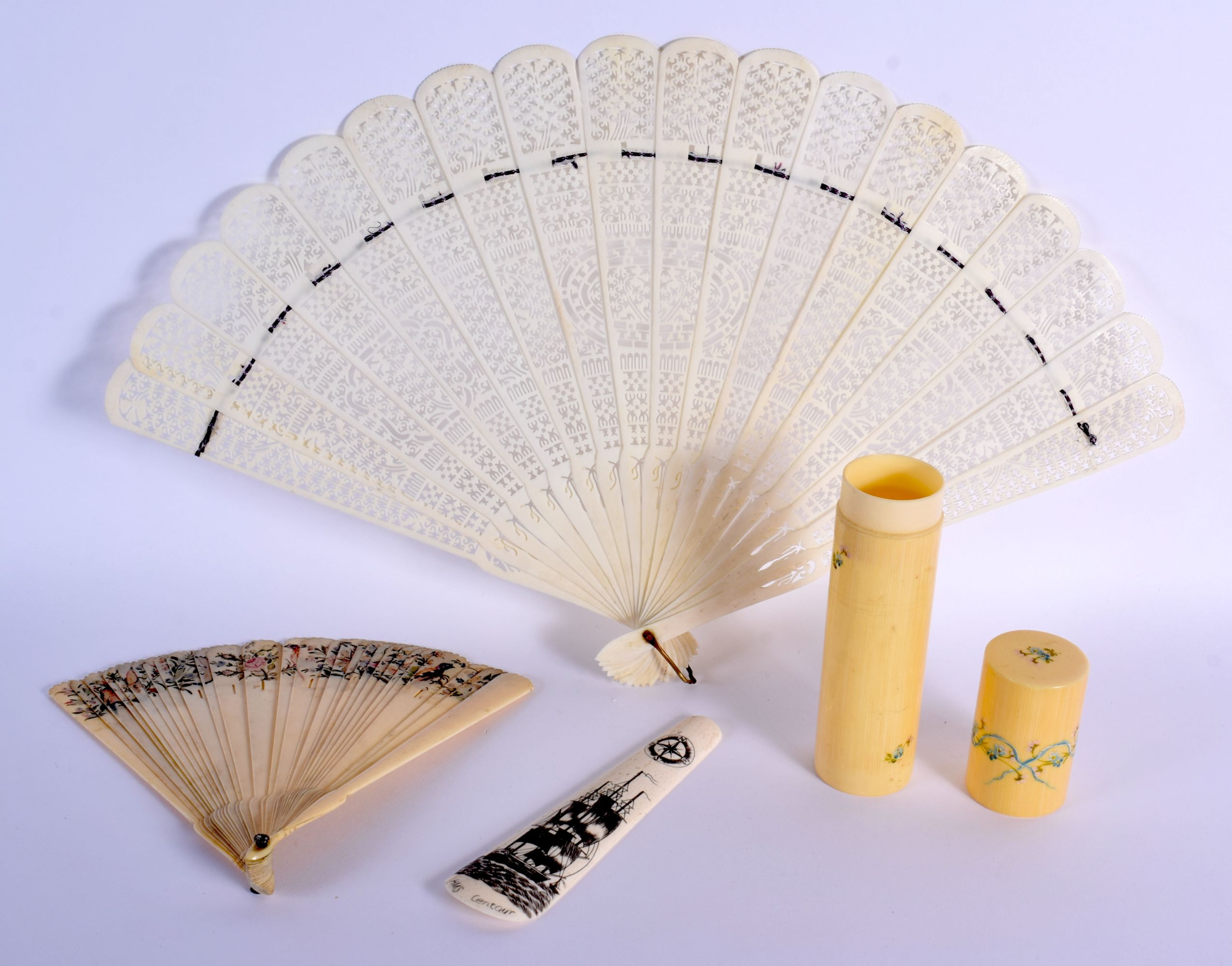 A LARGE 19TH CENTURY CONTINENTAL IVORY FAN together with a scrimshaw, cylinder case etc. Largest 42