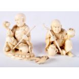 A PAIR OF 19TH CENTURY JAPANESE MEIJI PERIOD CARVED IVORY OKIMONO modelled holding staffs. 7 cm x 5