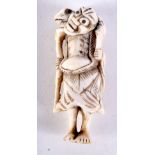 A 19TH CENTURY JAPANESE MEIJI PERIOD CARVED IVORY NETSUKE modelled as a male holding a toad. 6 cm hi