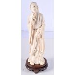 A LARGE 19TH CENTURY CHINESE CARVED IVORY FIGURE OF AN IMMORTAL modelled in flowing robes. 30 cm hig