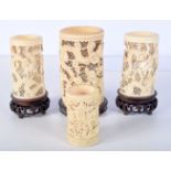 THREE 19TH CENTURY CHINESE CANTON IVORY OPEN WORK TUSK VASES and a dice shaker, decorated with drago