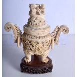 A LARGE 19TH CENTURY CHINESE CARVED TWIN HANDLED IVORY KORO AND COVER decorated with dragons. 26 cm