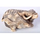 A LARGE 19TH CENTURY JAPANESE MEIJI PERIOD CARVED BONE NETSUKE modelled as a seated bullock. 6 cm x