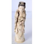 A 19TH CENTURY CHINESE CARVED IVORY IMMORTAL modelled holding flowers. 22 cm high.