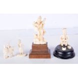 A 19TH CENTURY ANGLO INDIAN CARVED IVORY FIGURE OF A SNAKE CHARMER together with a musician and anot