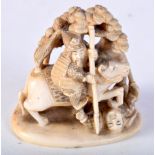 A 19TH CENTURY JAPANESE MEIJI PERIOD CARVED IVORY OKIMONO modelled as a samurai on horseback. 6 cm x