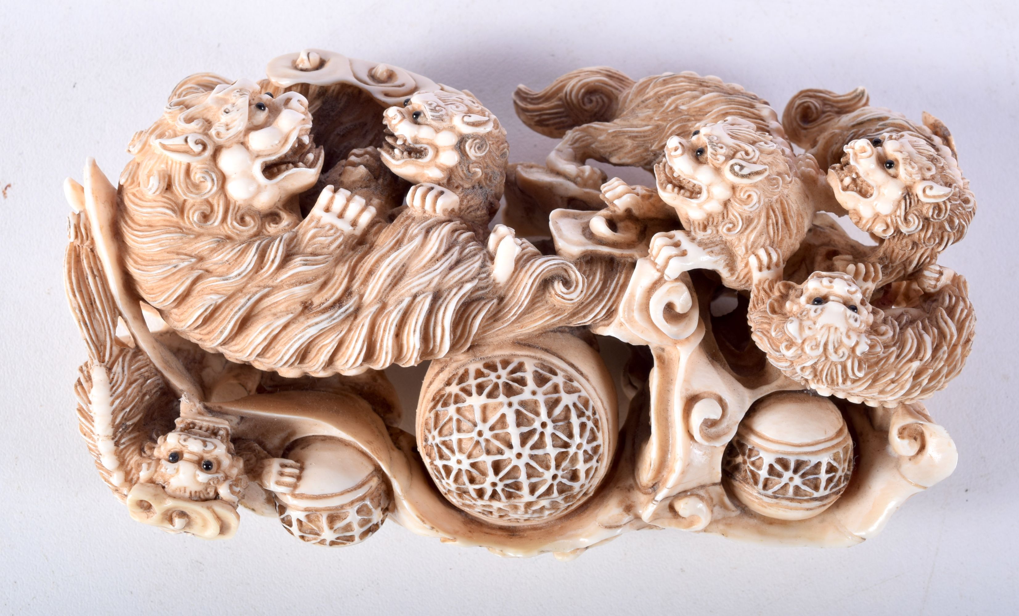 A FINE 19TH CENTURY JAPANESE MEIJI PERIOD CARVED IVORY OKIMONO modelled as numerous beasts in a play