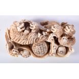 A FINE 19TH CENTURY JAPANESE MEIJI PERIOD CARVED IVORY OKIMONO modelled as numerous beasts in a play