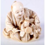 A GOOD 19TH CENTURY JAPANESE MEIJI PERIOD CARVED IVORY NETSUKE modelled as a male with puppets. 5 cm