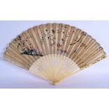 A FINE LATE 18TH CENTURY EUROPEAN CHINOSERIE FAN with carved sticks and decoupe paper leaf. 46 cm wi