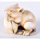 A 19TH CENTURY JAPANESE MEIJI PERIOD CARVED IVORY NETSUKE formed as a mouse upon a clam. 4 cm x 4 cm