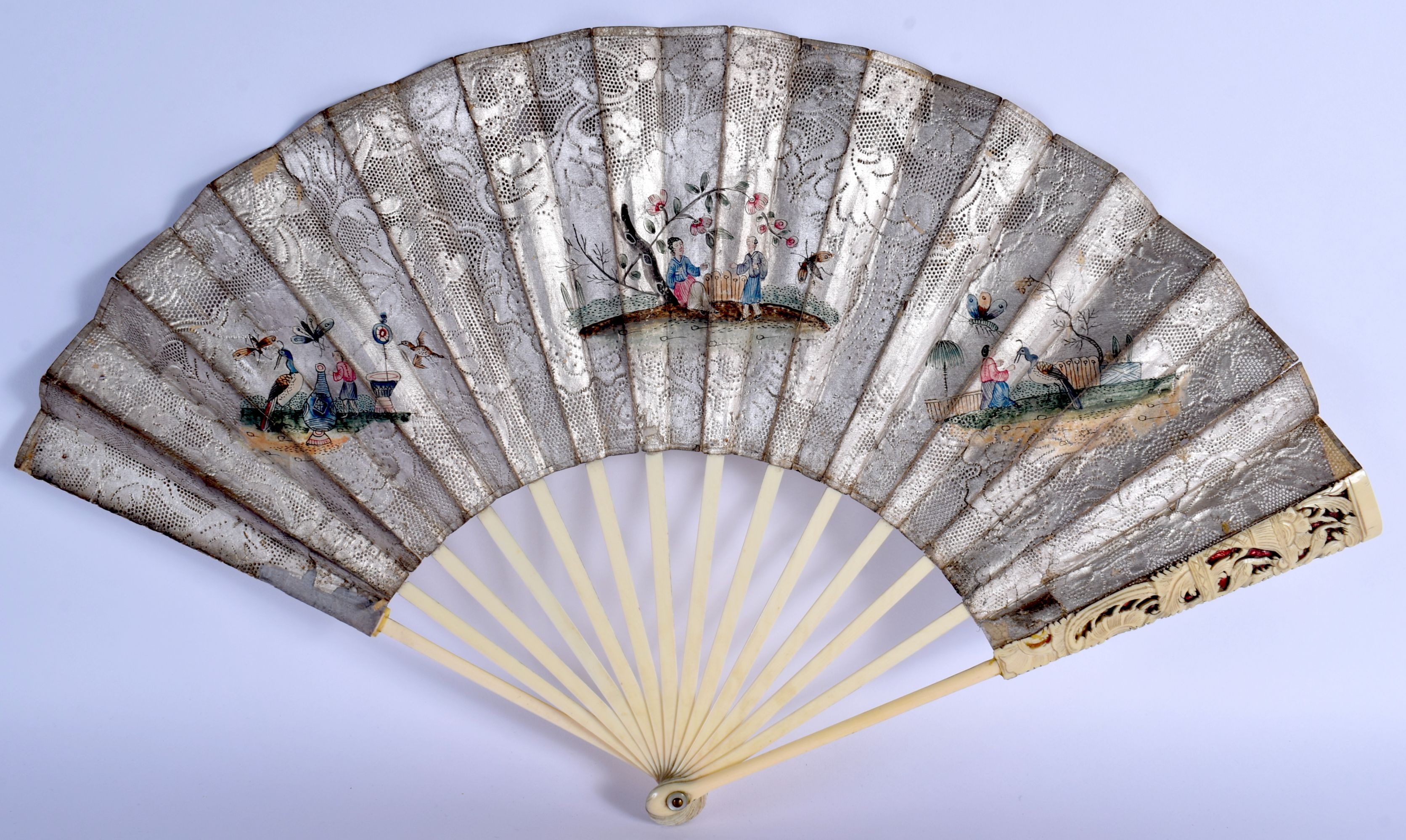 A LATE 18TH CENTURY EUROPEAN CHINOSERIE FAN with carved sticks and silvered decoupe paper leaf. 48 c