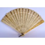 A MID 19TH CENTURY CHINESE CARVED IVORY BRISE FAN C1850 decorated with figures. 36 cm wide extended.