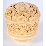 A 19TH CENTURY CHINESE CANTON IVORY BOX AND COVER decorated all over with dragons. 8 cm x 7 cm.