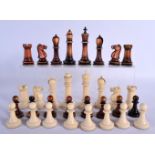 A FINE EARLY 19TH CENTURY JACQUES TYPE CARVED AND STAINED IVORY CHESS SET with finely carved feature