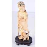 A 19TH CENTURY CHINESE CANTON IVORY FIGURE OF A FEMALE modelled beside a hound. 22 cm high.