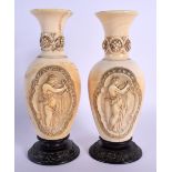 A PAIR OF 19TH CENTURY EUROPEAN DIEPPE CARVED IVORY VASES carved with figures within cartouches. 19