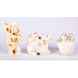 A FINE 19TH CENTURY JAPANESE MEIJI PERIOD CARVED IVORY BULL NETSUKE together with two others. Larges