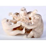 A 19TH CENTURY JAPANESE MEIJI PERIOD CARVED IVORY OKIMONO modelled as monkeys and birds. 6.5 cm x 4