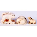 THREE 19TH CENTURY JAPANESE MEIJI PERIOD CARVED IVORY NETSUKES in various forms. 5 cm x 4 cm. (3)