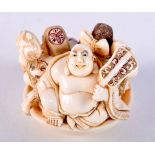 A 19TH CENTURY JAPANESE MEIJI PERIOD CARVED IVORY NETSUKE formed as three males upon a dish. 3.5 cm