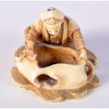 A 19TH CENTURY JAPANESE MEIJI PERIOD CARVED IVORY NETSUKE modelled as a male holding a sack. 3 cm x