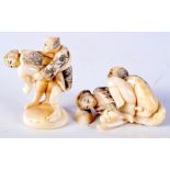 TWO EARLY 20TH CENTURY JAPANESE MEIJI PERIOD CARVED IVORY NETSUKES modelled as a couple in erotic st