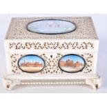 A FINE 19TH CENTURY INDIAN CARVED IVORY CASKET inset with seven painted ivory minaitures of landmark