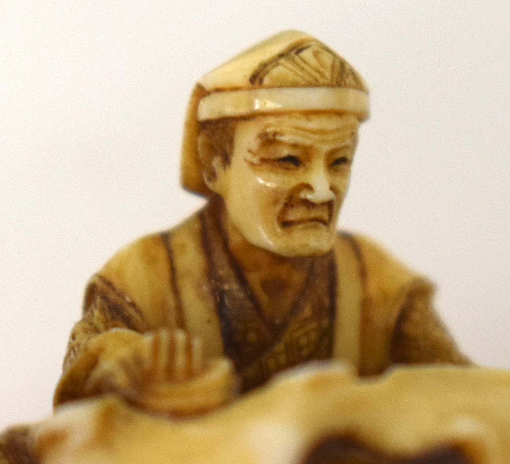 A 19TH CENTURY JAPANESE MEIJI PERIOD CARVED IVORY NETSUKE modelled as a male holding a sack. 3 cm x - Image 10 of 13