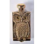 AN 18CT GOLD PLATED SCENT BOTTLE IN THE FORM OF AN OWL WITH GEM SET EYES. 6.8cm x 3cm, weight 49.5g