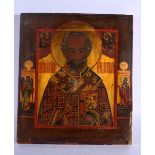 AN ANTIQUE PAINTED RUSSIAN WOOD ICON. 36 cm x 30 cm.