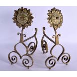 A PAIR OF ARTS AND CRAFTS BRONZE FIRE SIDE ANDIRONS of floral form. 34 cm x 22 cm.