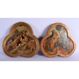 A PAIR OF ANTIQUE PAINTED RUSSIAN WOOD ICONS. 30 cm x 27 cm.