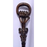 A VINTAGE AFRICAN TRIBAL CARVED WOOD MONKEY SHOOTING STICK. 90 cm long.