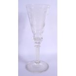 A LARGE EDWARDIAN SPIRAL TWIST GLASS GOBLET carved with armorial. 31 cm high.