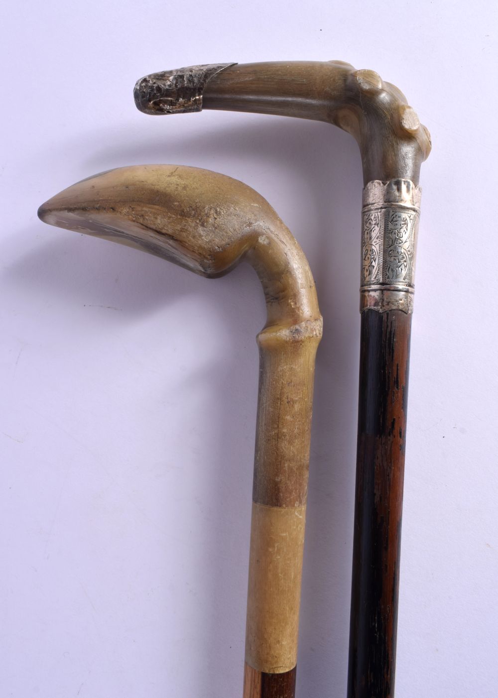 TWO 19TH CENTURY CONTINENTAL CARVED RHINOCEROS HORN WALKING CANES. 90 cm long. (2) - Image 2 of 3