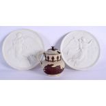 AN ANTIQUE STAFFORDSHIRE JASPER MUSTARD POT together with a pair of Bing & Grondahl plaques. (3)