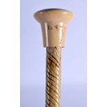 A GEORGE III CARVED IVORY AND WHALE BONE WALKING CANE. 83 cm long.