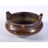 A CHINESE GOLD SPLASH BRONZE CENSER. 3.4cm x 6cm, weight 188g