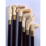 A SET OF SIX CONTINENTAL CARVED NOVELTY BONE WALKING CANES. 90 cm long. (6)
