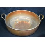A large copper cooking pot. 15 x 63cm.
