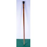 A wooden walking cane with an embossed white metal pommel probably silver 93 cm.