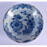 AN 18TH CENTURY DELFT BLUE AND WHITE TIN GLAZED BOWL painted with flowers. 24 cm diameter.