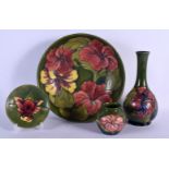 AN ANTIQUE WILLIAM MOORCROFT GREEN GROUND VASE together with a similar large bowl, vase & saucer. La