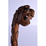 AN EARLY 20TH CENTURY SOUTH EAST ASIAN CARVED WOOD DRAGON WALKING CANE smothered in motifs. 85 cm lo