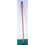 A wooden walking cane with an embossed silver pommel . 100 cm.