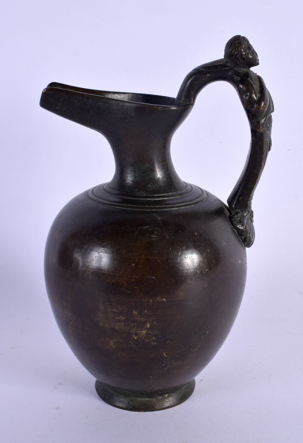 A 19TH CENTURY ITALIAN GRAND TOUR BRONZE EWER formed with a figural handle. 14.5 cm high.