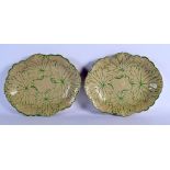 A PAIR OF 19TH CENTURY WEDGWOOD LEAF MOULDED DISHES painted with green sprays. 26 cm x 21 cm.